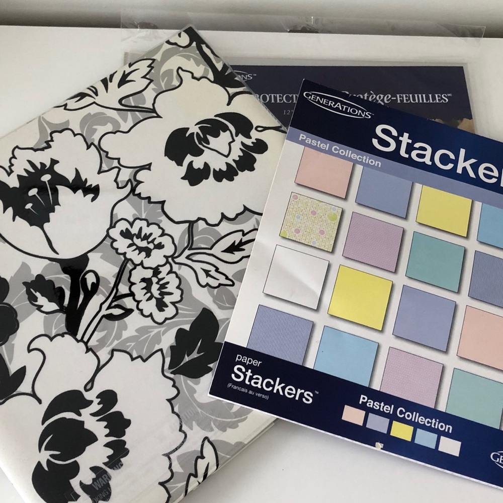 Scrapbook with papers and page protectors